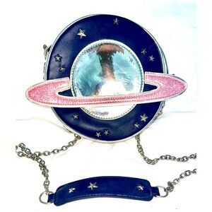 Horoscopes from Dolls Kill Saturn metallic planet festival round zipper purse
